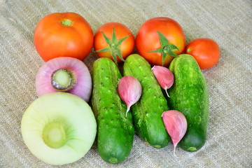 Fresh vegetables. Tomatoes, cucumbers, garlic, onions.
