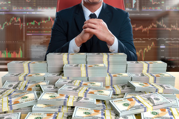 businessman sitting with pile of 100 dollar banknote - obrazy, fototapety, plakaty