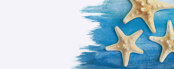 vacation and summer concept star fish banner with watercolor blue summer flat lay background.