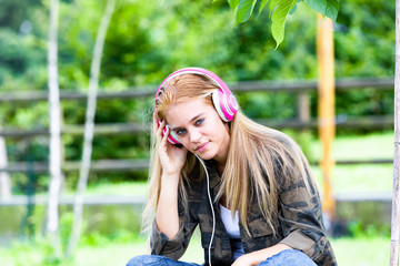 Attractive young woman listening to music