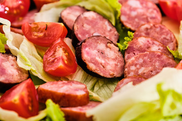 Sliced sausages with vegetables