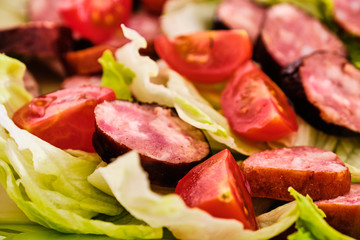 Sliced sausages with vegetables