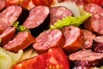 Sliced sausages with vegetables