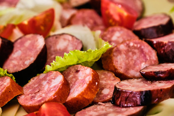 Sliced sausages with vegetables
