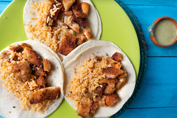 Mexican chicken milanese tacos with red rice