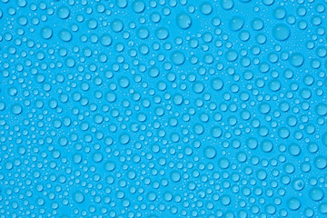 closeup drops water on blue background