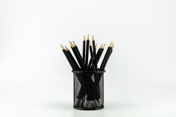 pencils in basket on a white table. - work and business ideas concept.