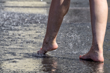 Walk barefoot in the rain through the puddles.