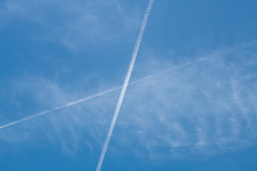 X sign in the sky by plane trails