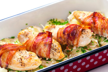 still life of poultry roulade with bacon