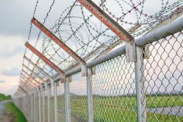 wire mesh steel with green grass background in Phuket Thailand