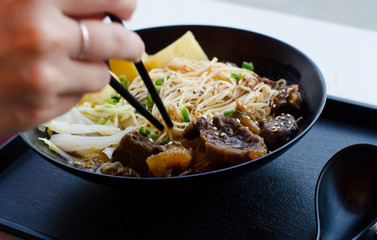 Closeup of a bowl of beef and vegetable stir fry.