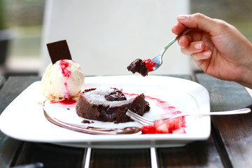 chocolate lava with vanilla ice cream on wood table