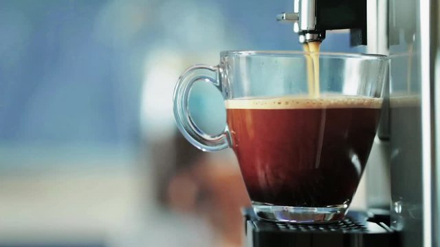 Cinemagraph: Preparation of natural delicious coffee in the automatic coffee machine. A charge of vivacity every day. Good morning