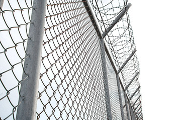 Texture the cage metal net isolate on white background. fence with barbed wire