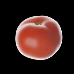 Tomato isolated on black. Without leaves. Side view. Close up.