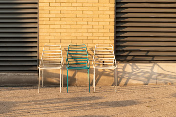 three chairs and their shadows