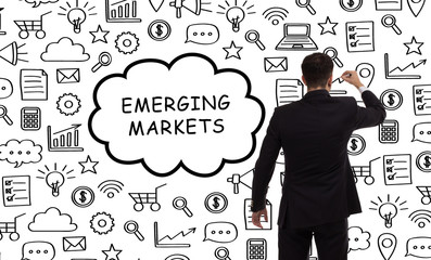 Business, technology, internet and networking concept. Young entrepreneur showing keyword: Emerging...