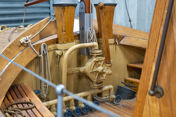 Lever control antique wooden locka. Ancient wooden ship of the 19th century. Technologies of the last century