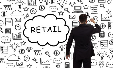 Business, technology, internet and networking concept. Young entrepreneur showing keyword: Retail