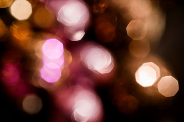 Christmas background, bokeh in dark colors, bokeh in purple and gold colors