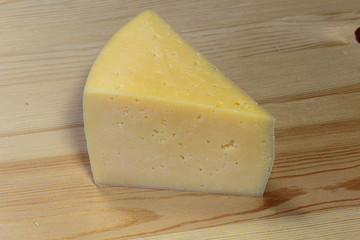 Slicing cheese on a cutting board.