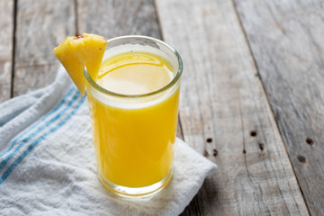 Pineapple juice with piece of fruit
