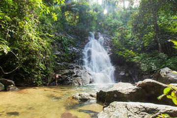 Naklejka na ściany i meble Rainbow Waterfall ,in the forest tropical zone ,national park Takua pa Phang Nga Thailand