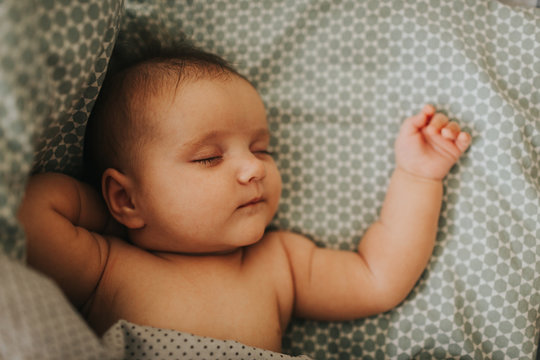 Close up image of 3 month baby sleeping. Selective focus.
