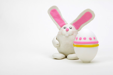 Plasticine rabbit with easter eggs.