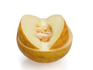 Yellow ripe melon. Melon in the cut. Half and two slices on top. On a white background. Still life. Close-up.