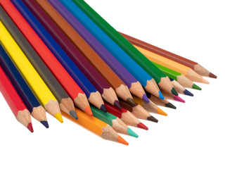 Fototapeta premium There are colored pencils on a diagonal in two floors. On a white background. Still life. Close-up.
