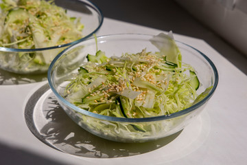 Fresh vegetable salad in transparent plates