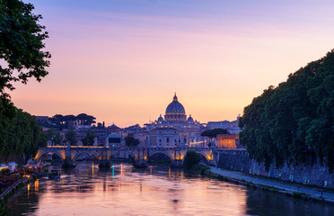 Naklejka premium Saint Peter's Basilica with Sant' Angelo's Bridge over Tiber at sunset, Rome, Italy