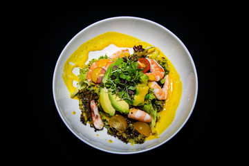 a tropical prawn and avocado salad taken from a birds eye view 