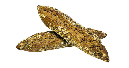 Side view of two breads baked with various seeds (pumpkin, flax, oatmeal, millet) isolated on a white background.