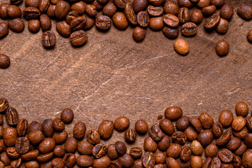 Coffee beans on wood background