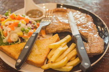 Pork steak in a delicious cafe in Bangkok Thailand