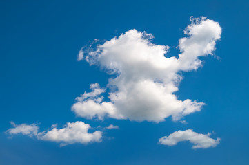 Naklejka na ściany i meble Cloud on the blue sky. Blue sky and big cloud in windy summer weather.