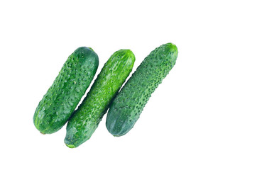 Fresh cucumbers isolated on white background. The view from the top. Background of organic food.