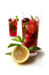 İced mint water with fresh cherry isolated on white background. Diet.