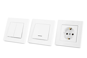 white set of switches and sockets for European type home wiring, isolated on white