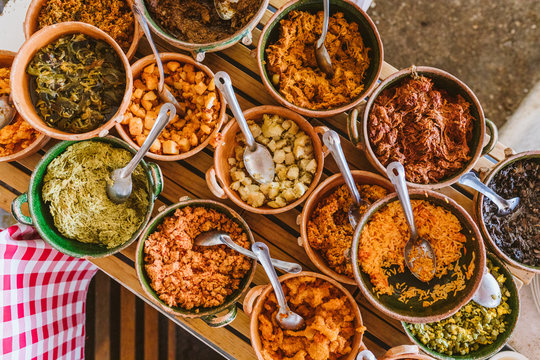 quesadilla toppings and fillings in clay pots with metal spoons