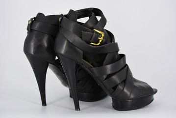 Sexy glamorous black women's sandals from genuine cowhide matte leather on high heels. Fashion...