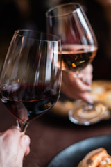 Making toast with glasses of wine