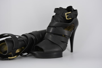 Sexy glamorous black women's sandals from genuine cowhide matte leather on high heels. Fashion...