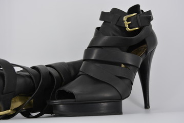 Sexy glamorous black women's sandals from genuine cowhide matte leather on high heels. Fashion...