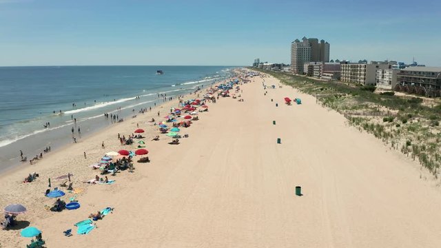 People Flock to the Beach on a 90 plus degree day in Ocean City Maryland