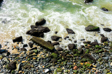 stones in the water and waves and water