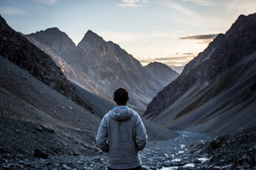 Figure overlooking a mountain scene in New Zealand
